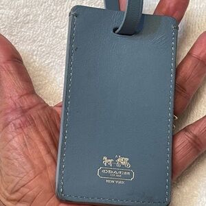 Blue coach luggage tag used